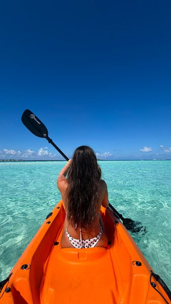 Kayaking in turquoise lagoon Maldives Ritrella day charter